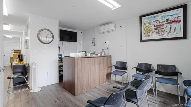 a work room with furniture and wooden floor