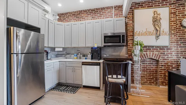 a view of a hallway with wooden floor and windows
