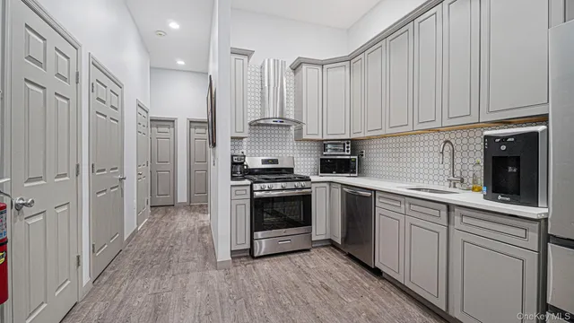 a view of a house with wooden fence