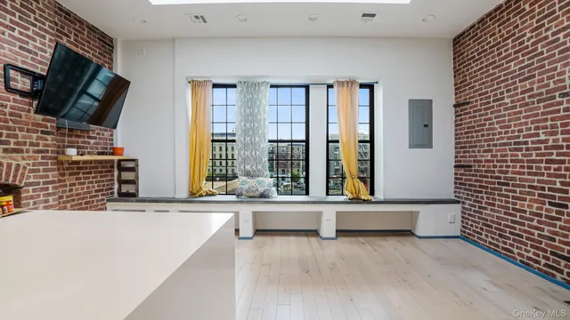 a view of a workspace with furniture