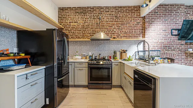 a living room with a flat screen tv and a fireplace
