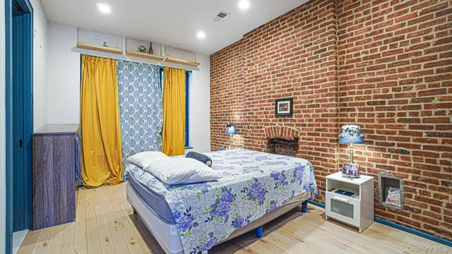 a kitchen with stainless steel appliances kitchen island granite countertop a stove top oven a sink a dining table and chairs