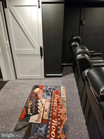 a room with furniture and screen pool table