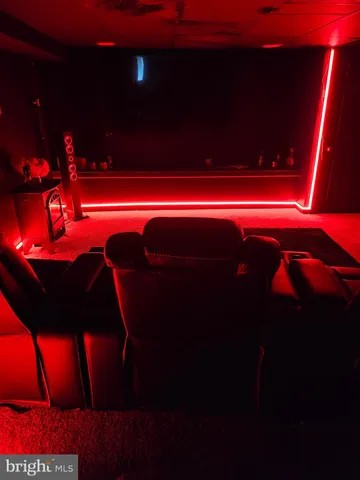 a backyard of a house with barbeque oven table and chairs