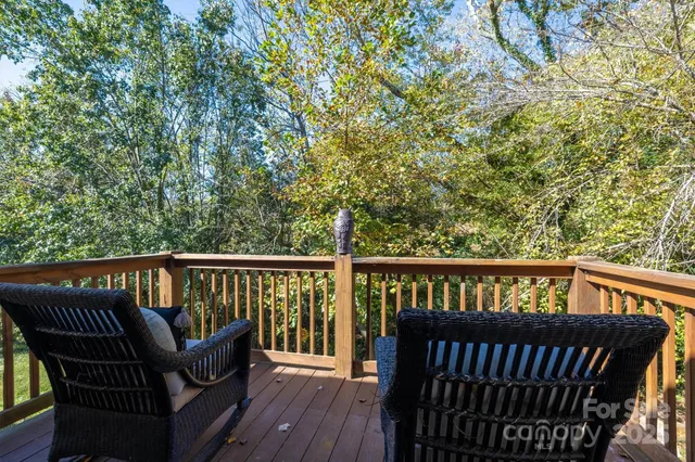 a view of a two chairs in the balcony
