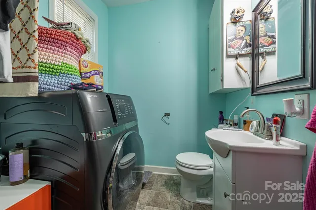 a bathroom with a toilet and a sink