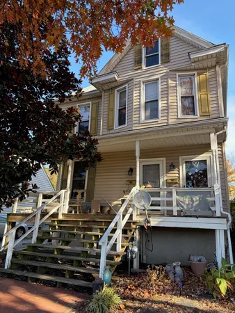 a front view of a house with barbeque oven
