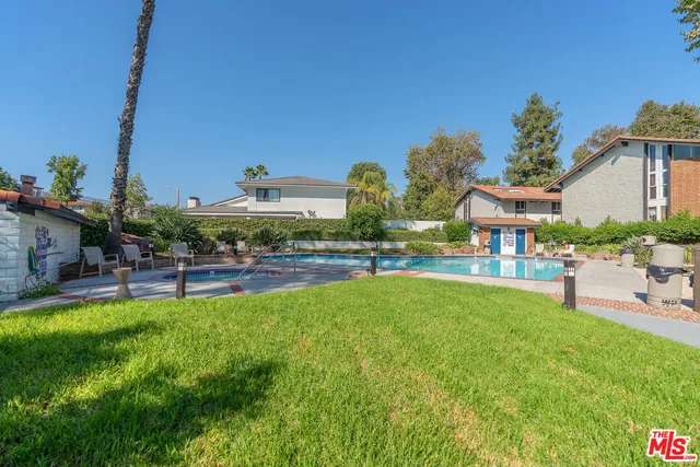 a view of a swimming pool with a patio