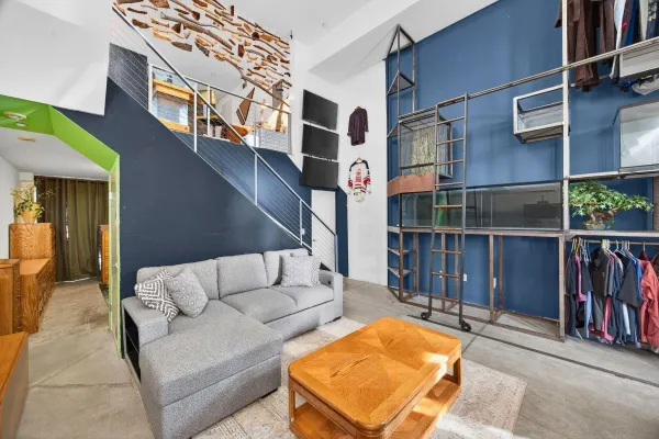 a balcony with furniture and wooden floor