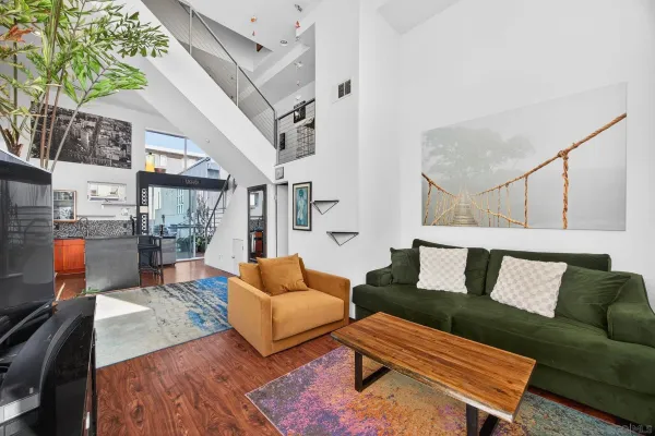 a living room with furniture and a rug