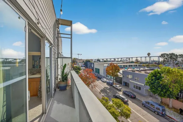 a view of a balcony with a patio