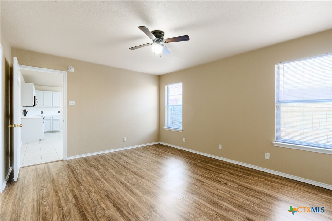 4701 Neta Drive Killeen, TX 76549 - Photo 14 of 28 wooden floor in an empty room with a window