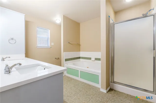 a bathroom with a sink a mirror and a bathtub