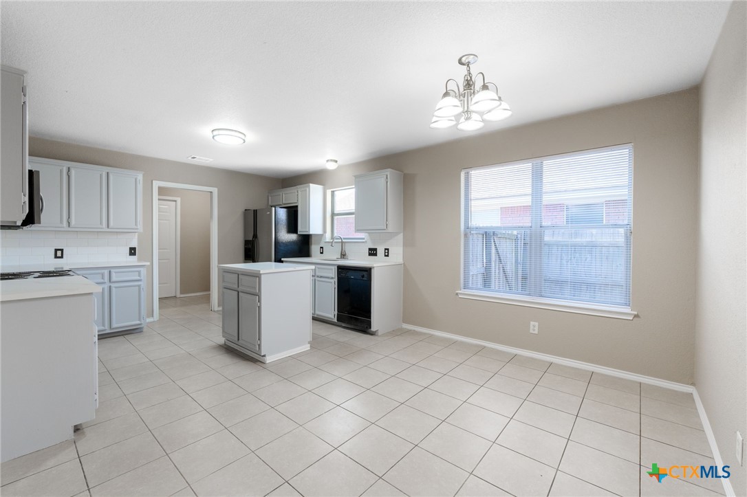 4701 Neta Drive Killeen, TX 76549 - Photo 8 of 28 a kitchen with a cabinets and window