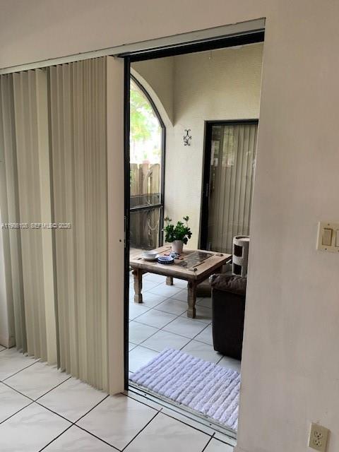 513 Racquet Club Road, Unit 55 Weston, FL 33326 - Photo 19 of 25 a view of a hallway and a livingroom with furniture