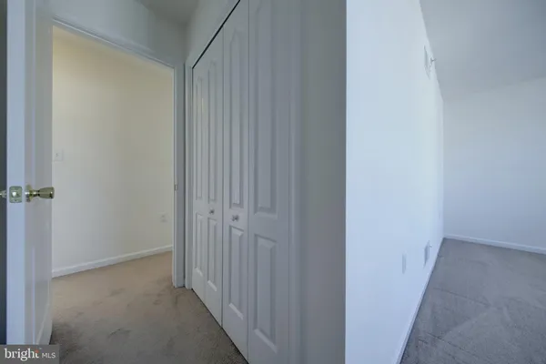 a view of a hallway with a shower