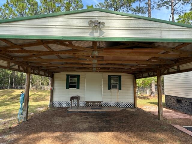 60 Magnolia Court Freeport, FL 32439 - Photo 23 of 29 a view of a house with a garage