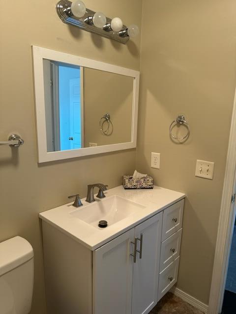 60 Magnolia Court Freeport, FL 32439 - Photo 10 of 29 a bathroom with a sink and mirror with toilet