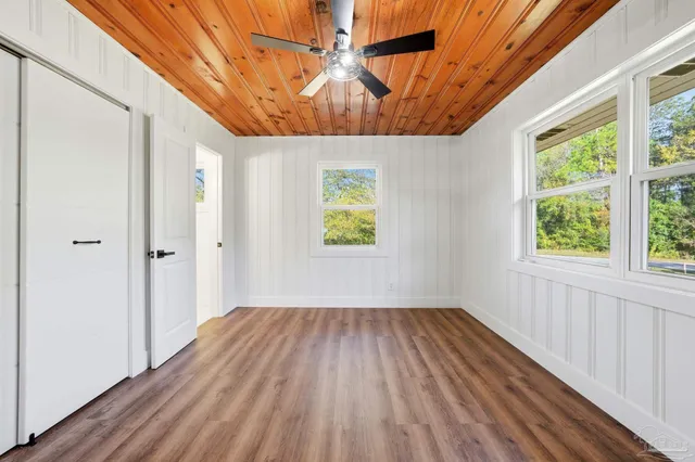 a view of room with window and hardwood floor