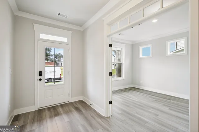 a front view of a house with a yard table and chairs