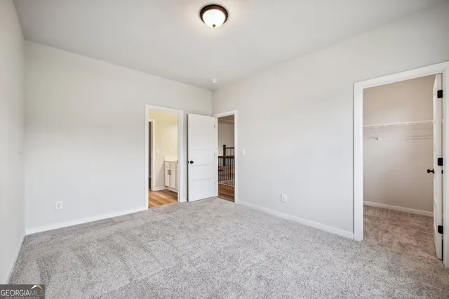 a view of a pathway of a house with a garden