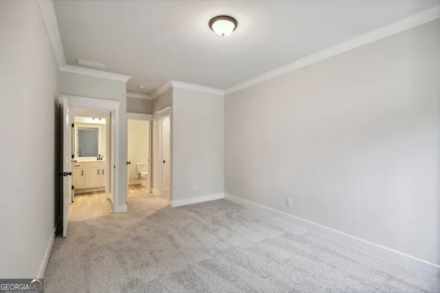 a front view of a house with a yard table and chairs
