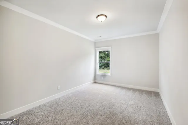 a view of a chairs and table in front of house