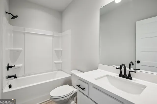 a group of people sitting in front of a store