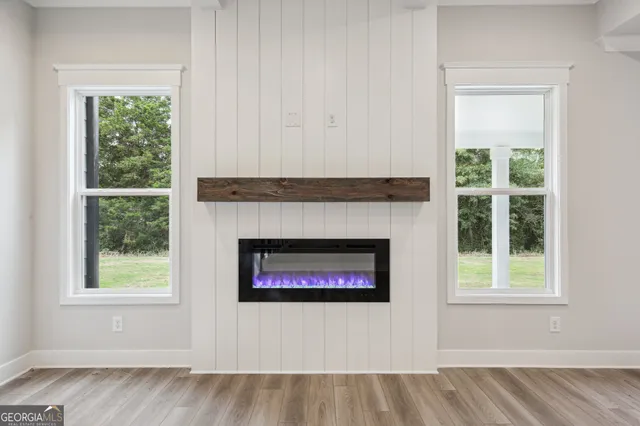 a kitchen with a sink white cabinets and appliances