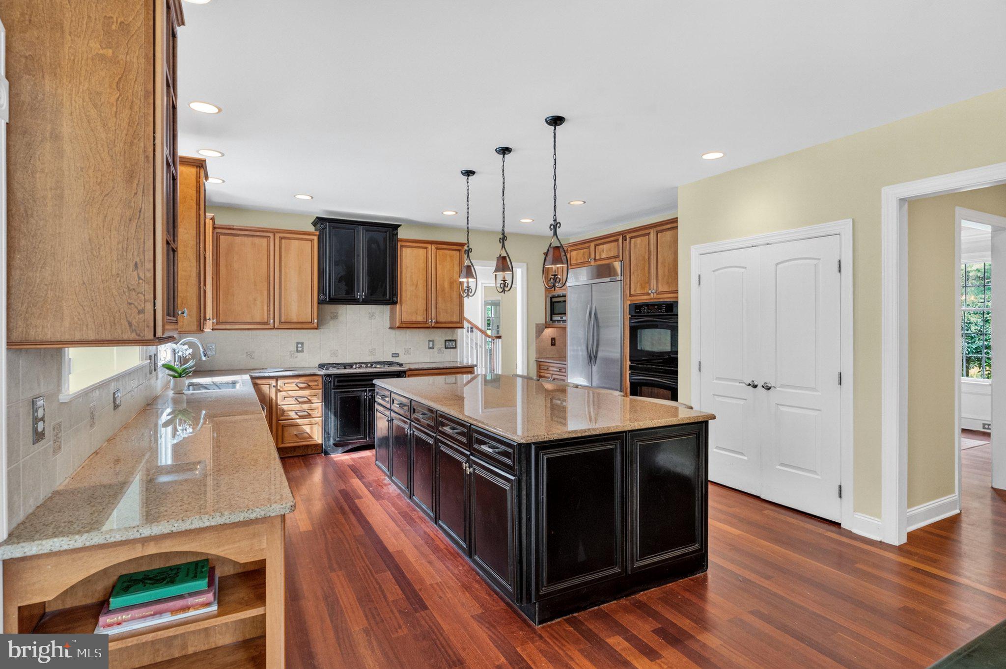 342 Ring Road Chadds Ford, PA 19317 - Photo 23 of 95 Elegant kitchen with rich wood tones.