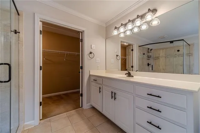 an aerial view of a house with a yard and lake view