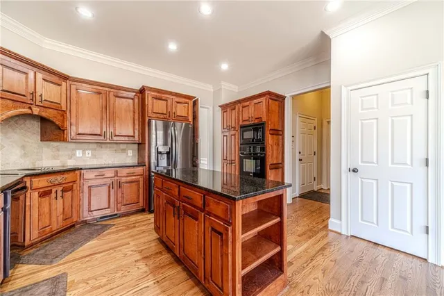 a very nice looking room with a chandelier fan