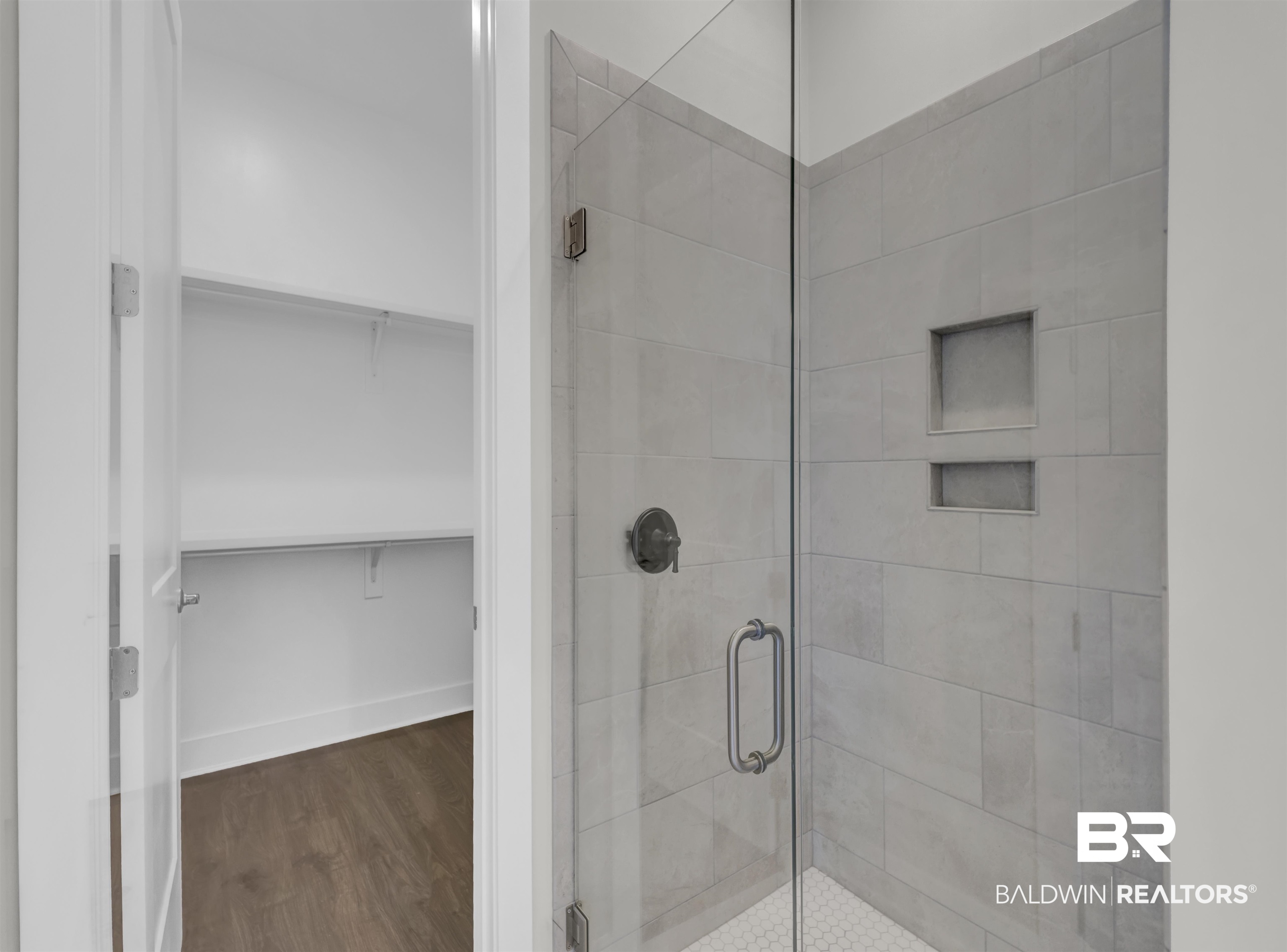 571 Morning Mist Way Fairhope, AL 36532 - Photo 26 of 47 Full bath with a walk in closet, a stall shower, and dark wood-type flooring