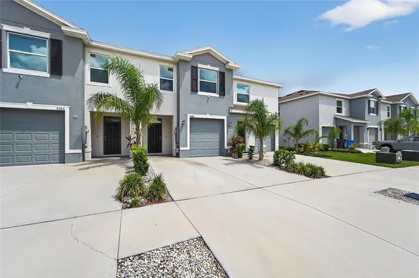 a front view of a building with garden