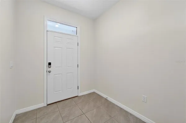 an empty room with closet area