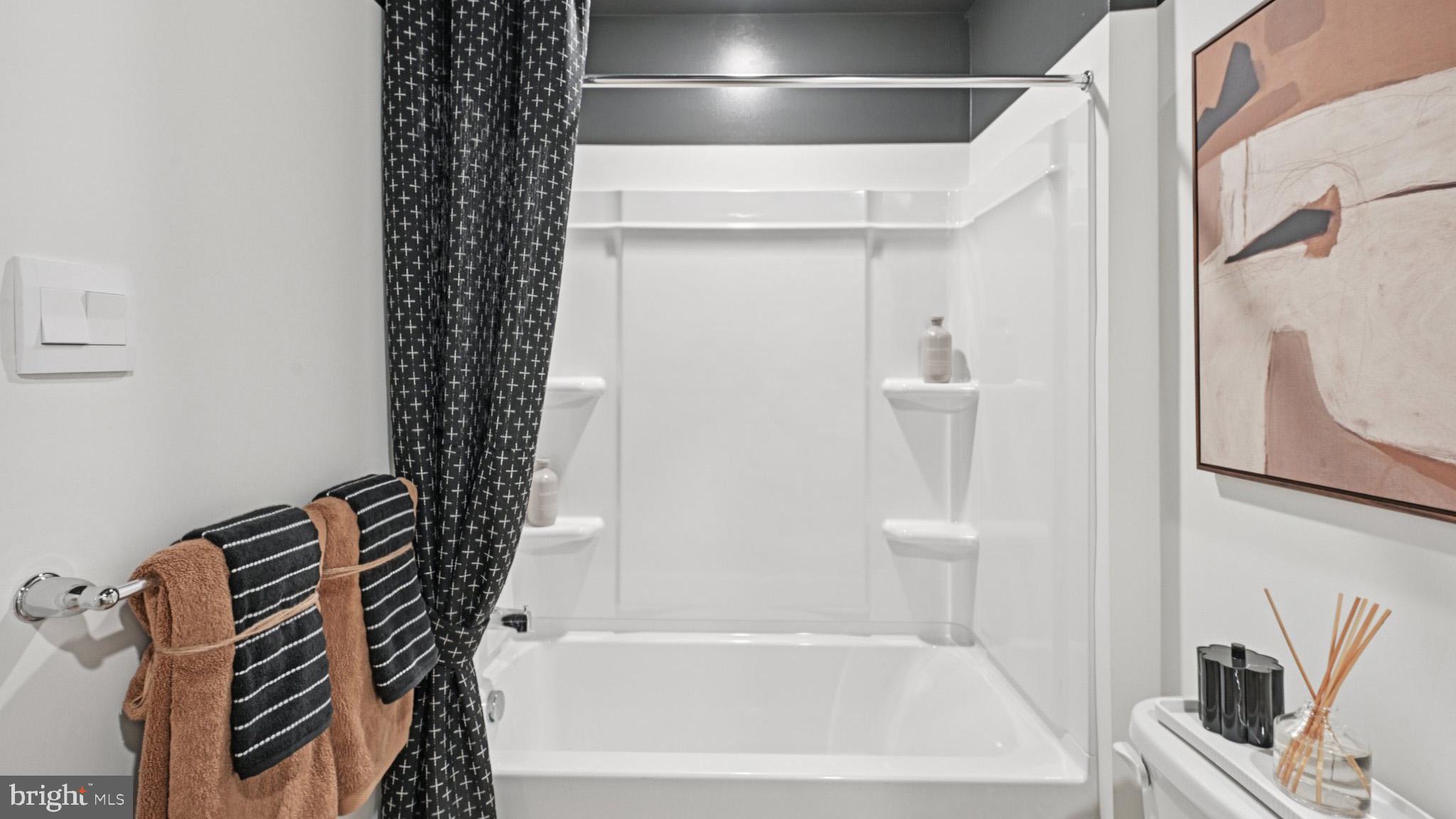 22 Reagan Drive Runnemede, NJ 08078 - Photo 29 of 48 a bathroom with a bathtub and shower