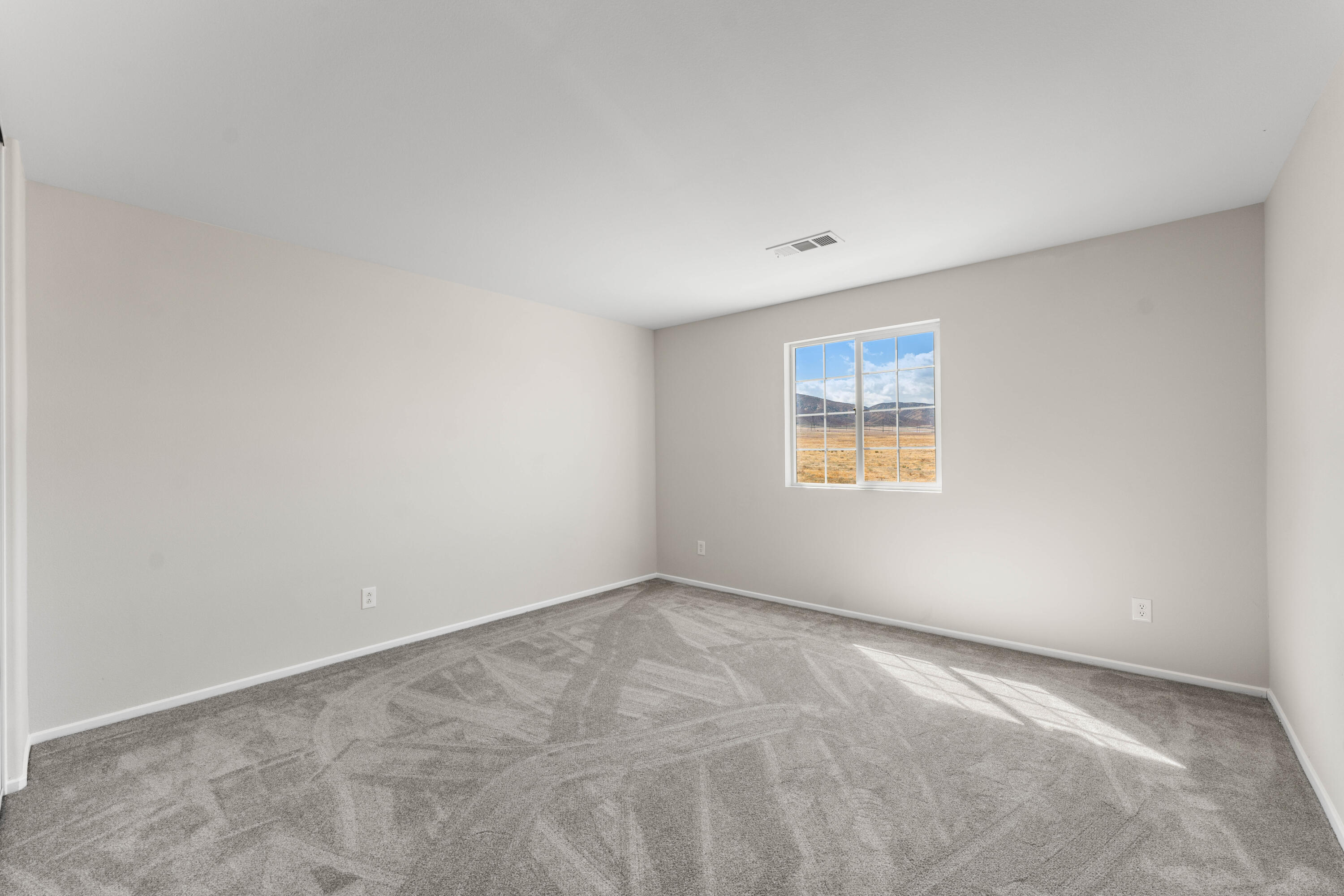 42570 72nd Street West Lancaster, CA 93536 - Photo 23 of 43 a view of an empty room with a window