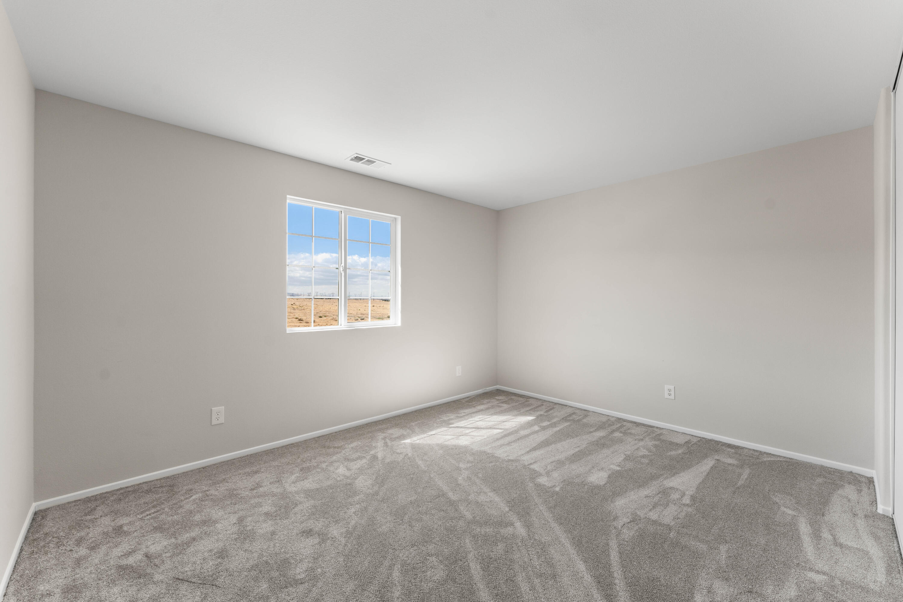 42570 72nd Street West Lancaster, CA 93536 - Photo 27 of 43 a view of an empty room with a window