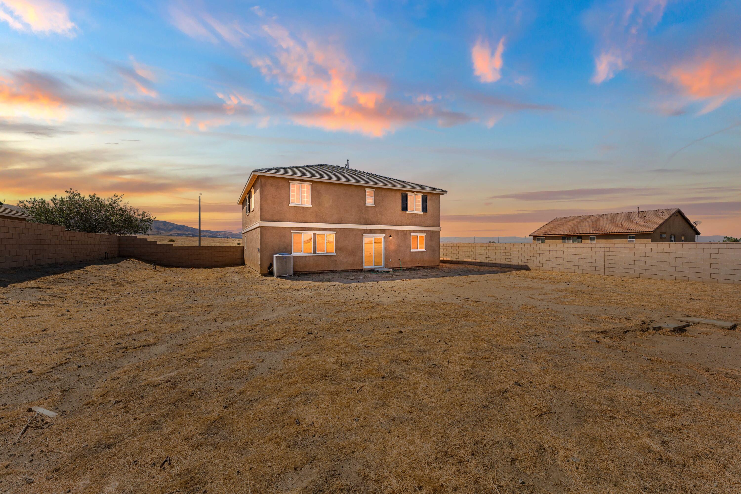 42570 72nd Street West Lancaster, CA 93536 - Photo 32 of 43 a view of a house with a yard
