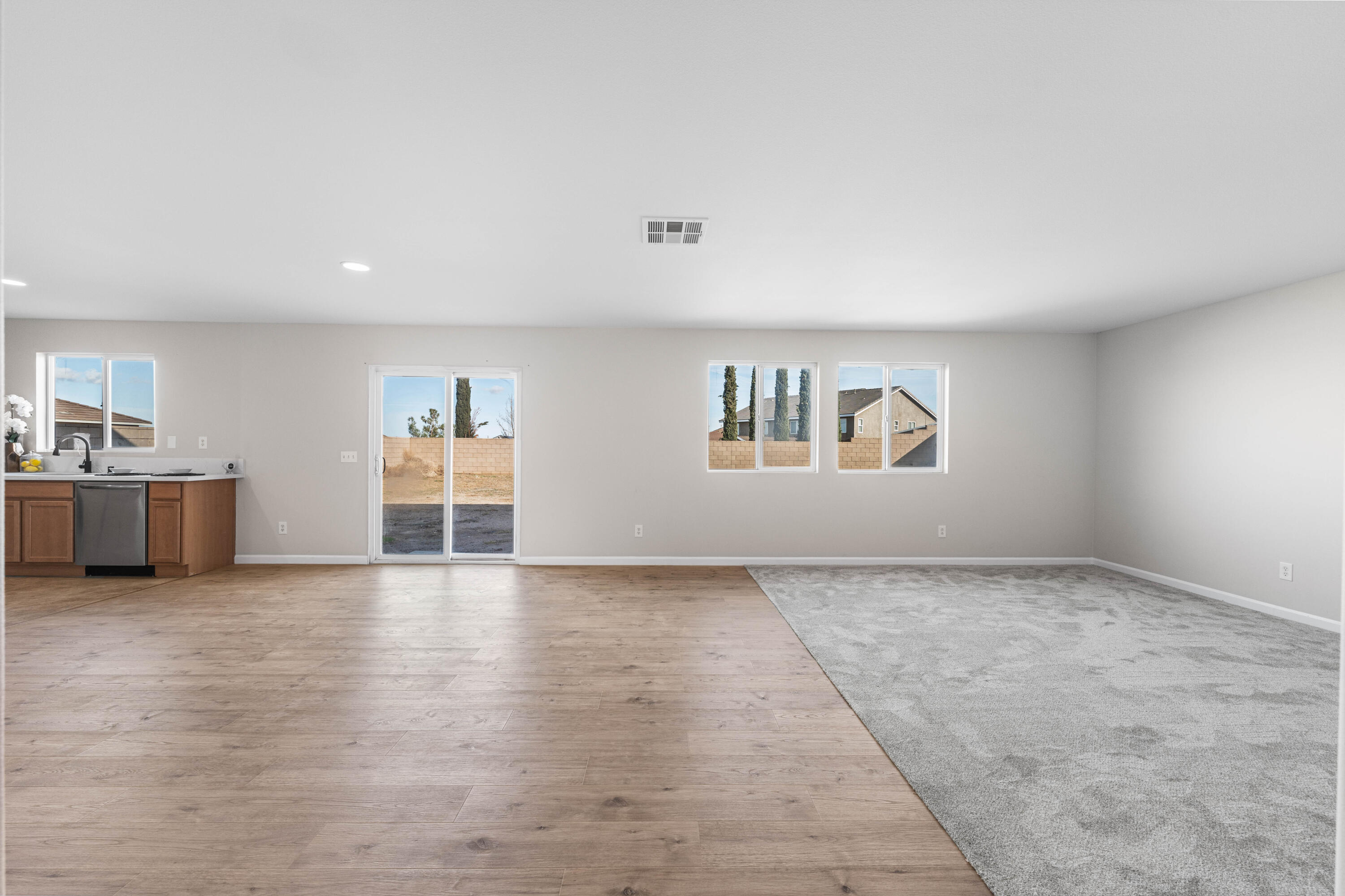 42570 72nd Street West Lancaster, CA 93536 - Photo 5 of 43 a view of a livingroom with wooden floor and a fireplace