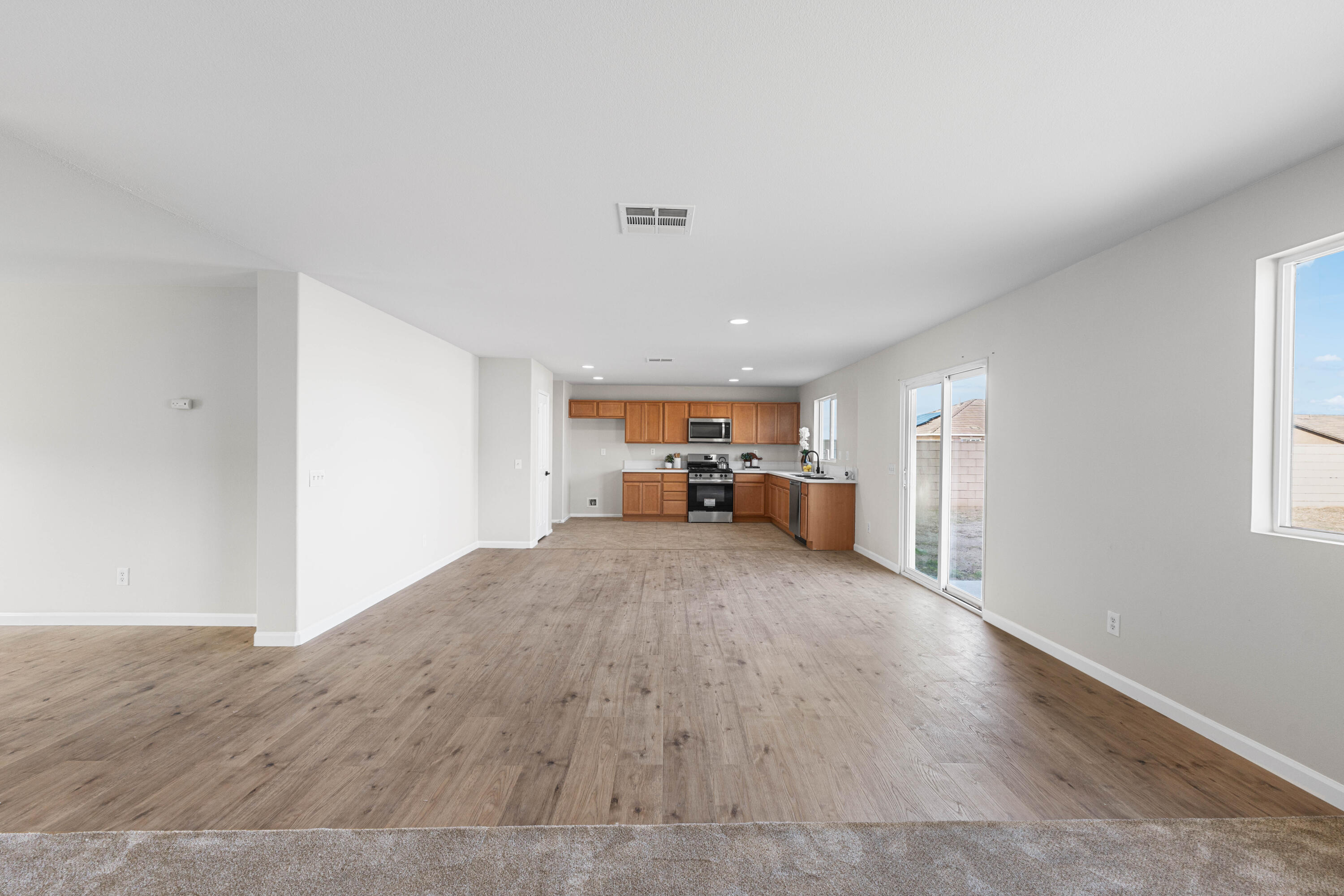 42570 72nd Street West Lancaster, CA 93536 - Photo 8 of 43 a view of a livingroom with wooden floor