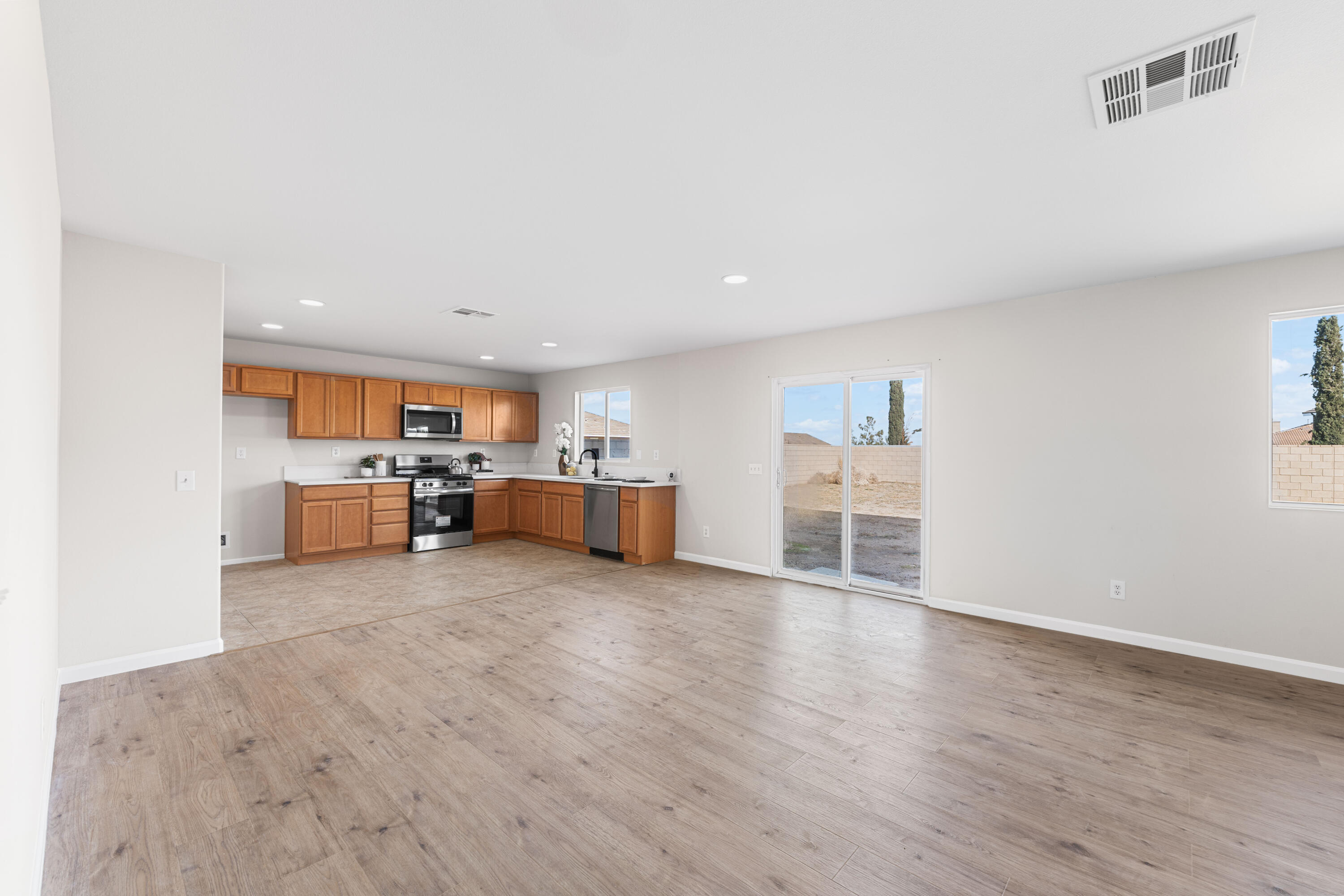 42570 72nd Street West Lancaster, CA 93536 - Photo 9 of 43 a view of a kitchen with furniture and a kitchen view