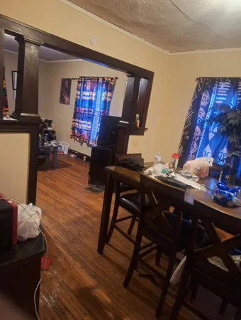 a view of a livingroom with furniture and a window