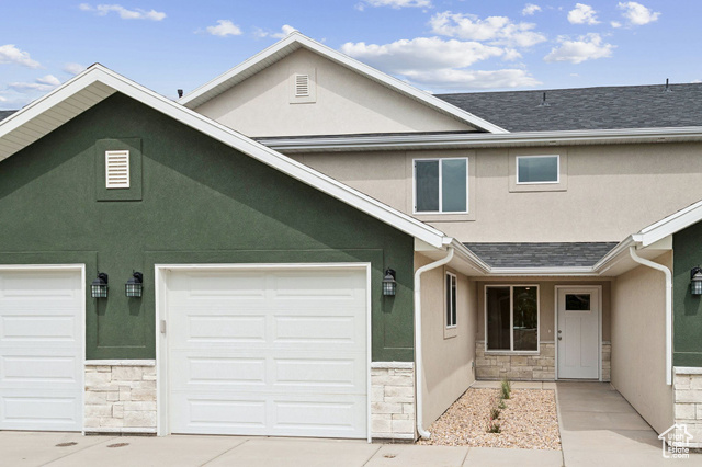 1615 North Angel Street, Unit H Layton, UT 84041 - Photo 1 of 55 Traditional-style home featuring stucco siding and stone siding