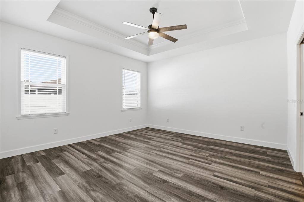 24302 Southwest 18th Road Newberry, FL 32669 - Photo 11 of 30 wooden floor in an empty room with a window
