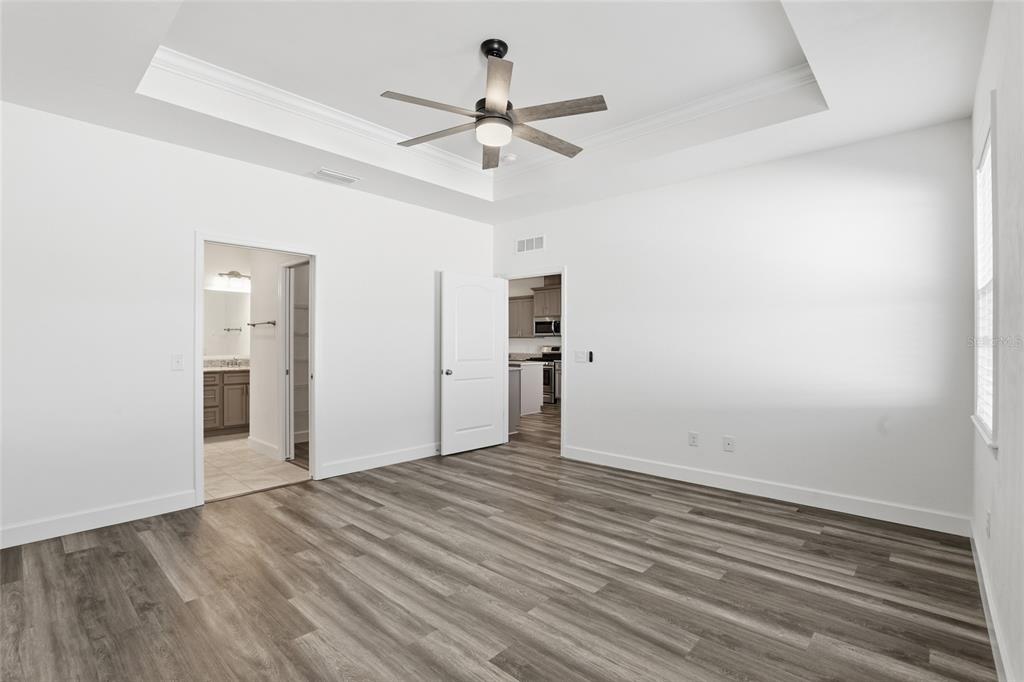 24302 Southwest 18th Road Newberry, FL 32669 - Photo 12 of 30 wooden floor in an empty room