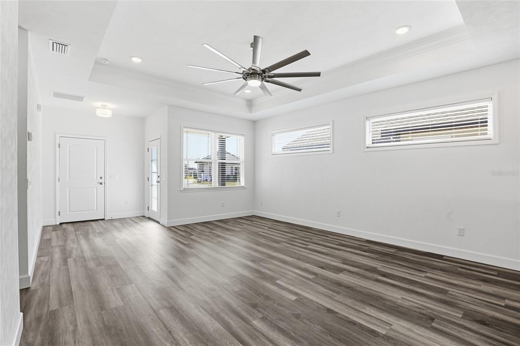 24302 Southwest 18th Road Newberry, FL 32669 - Photo 13 of 30 wooden floor in an empty room with a window