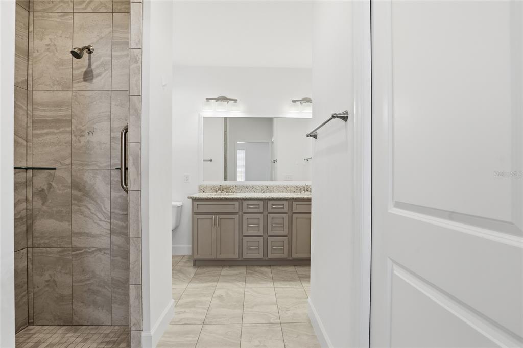 24302 Southwest 18th Road Newberry, FL 32669 - Photo 18 of 30 a bathroom with a shower and a sink