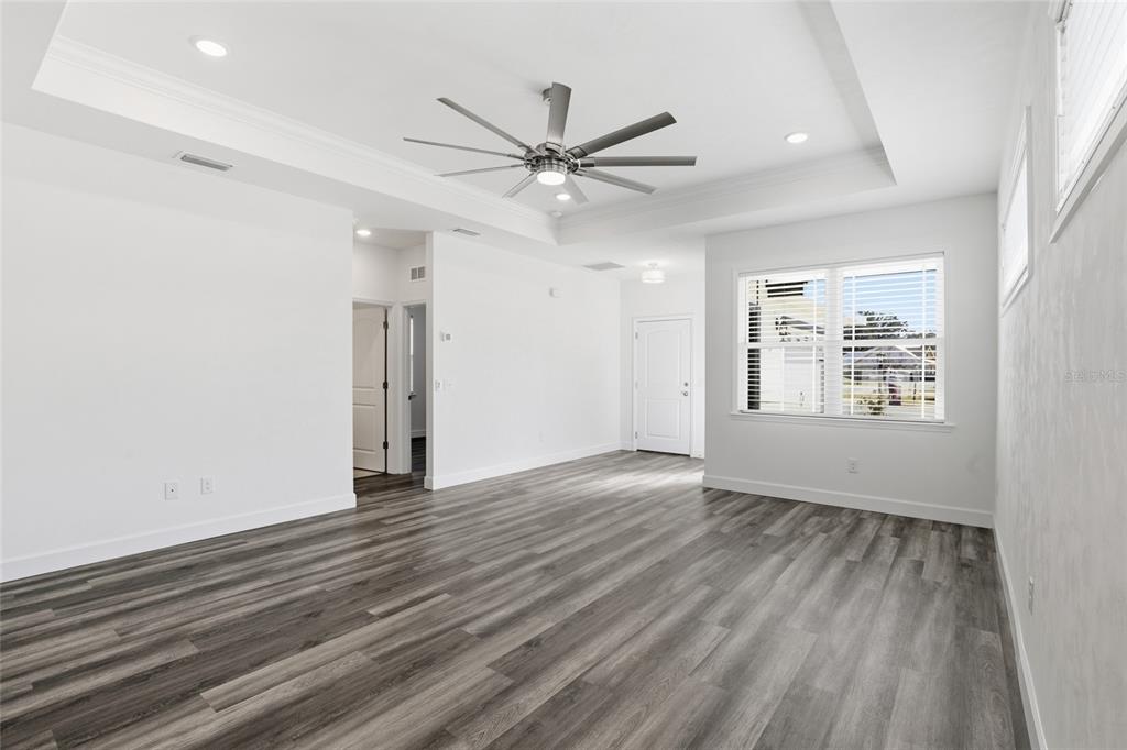 24302 Southwest 18th Road Newberry, FL 32669 - Photo 23 of 30 wooden floor in an empty room with a window