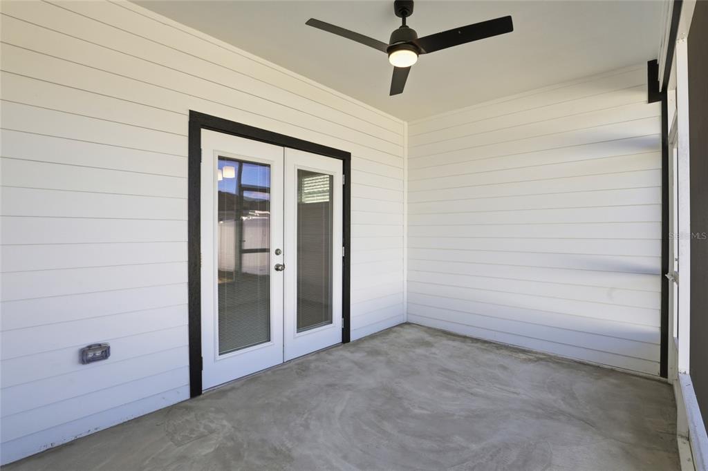 24302 Southwest 18th Road Newberry, FL 32669 - Photo 25 of 30 an empty room with a ceiling fan and a window